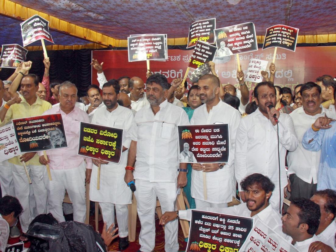 Free rice: Karnataka Congress stages protest, BJP hits back